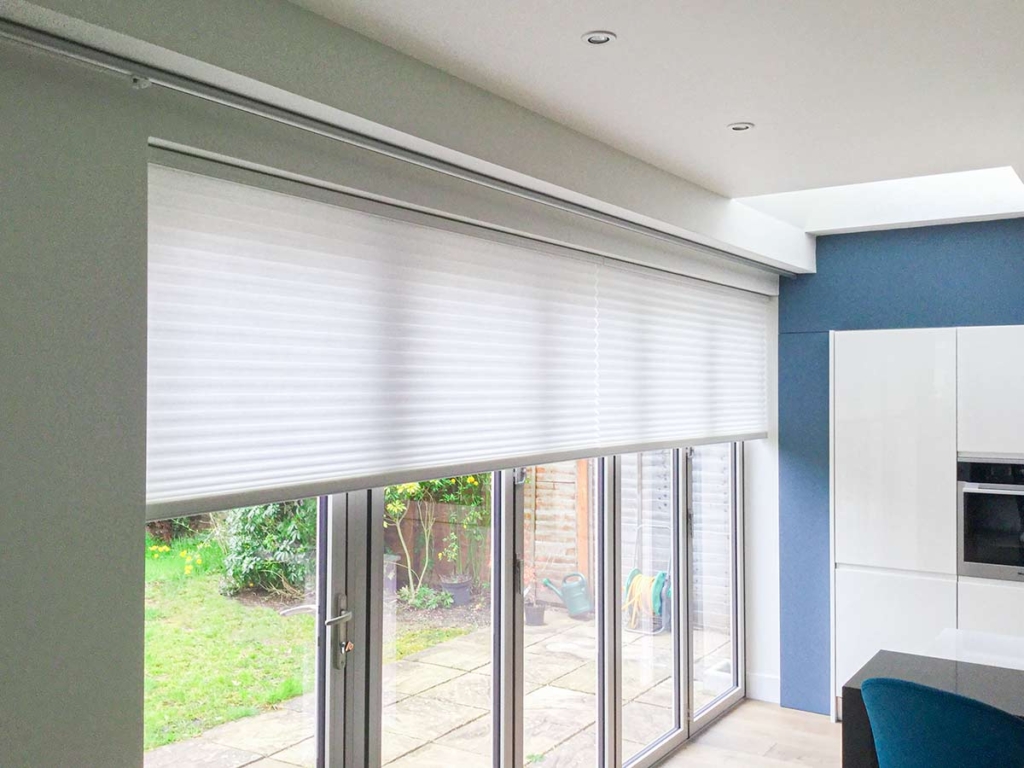 Free-hanging Duette® Folding Door Blinds