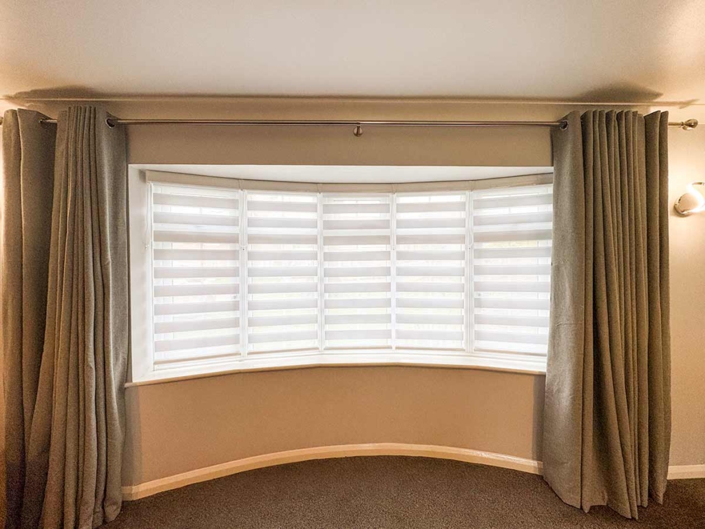 Japandi Duo Roller Blinds fitted in a bay window